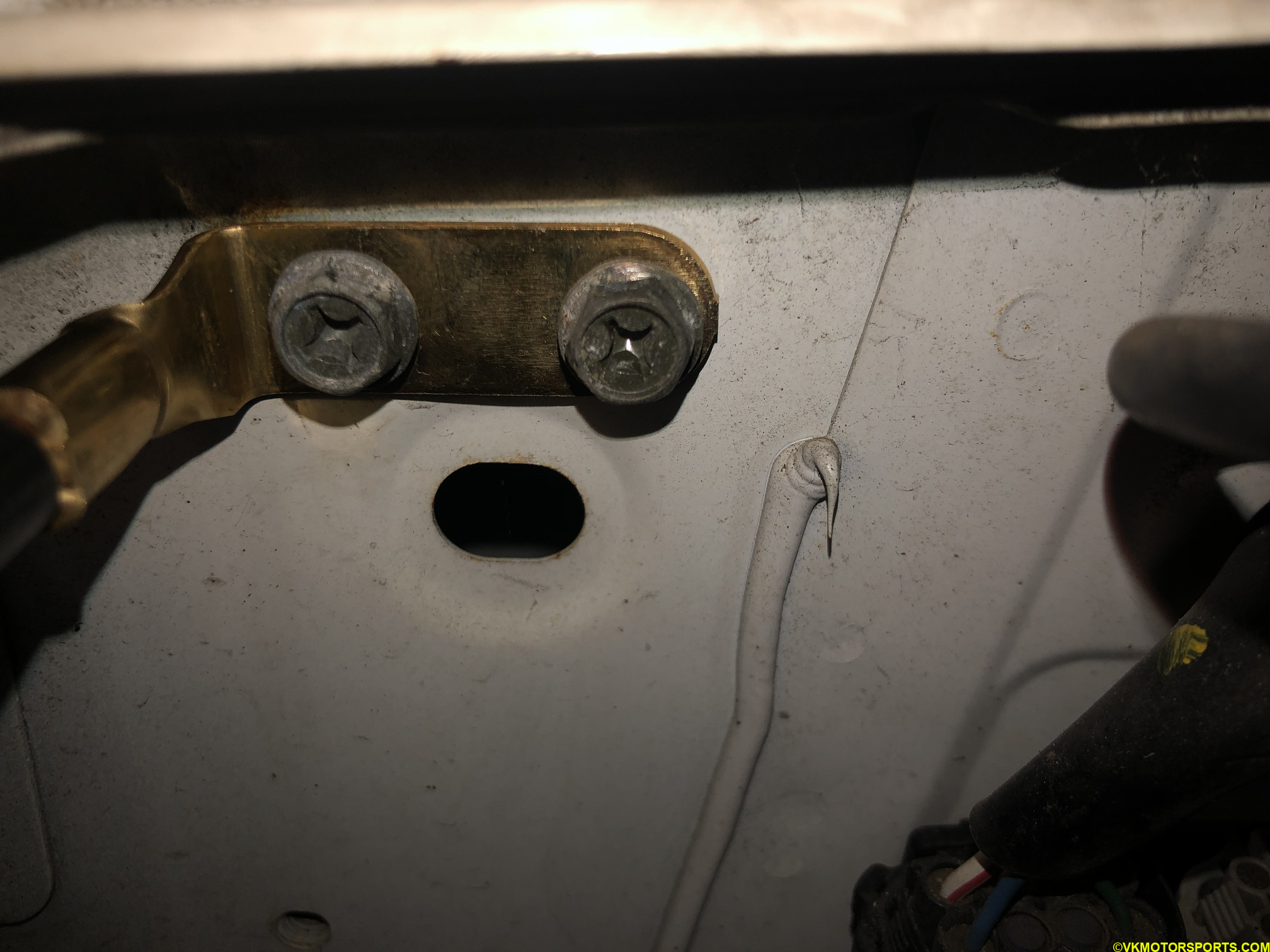 Figure 1. Bolts where the battery terminal cable is attached on the body 