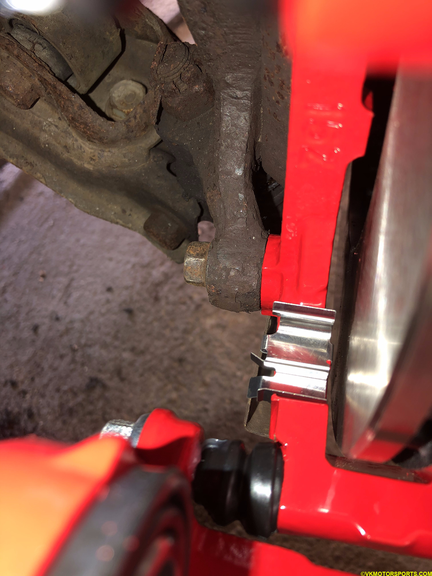 Place clips on the caliper bracket
