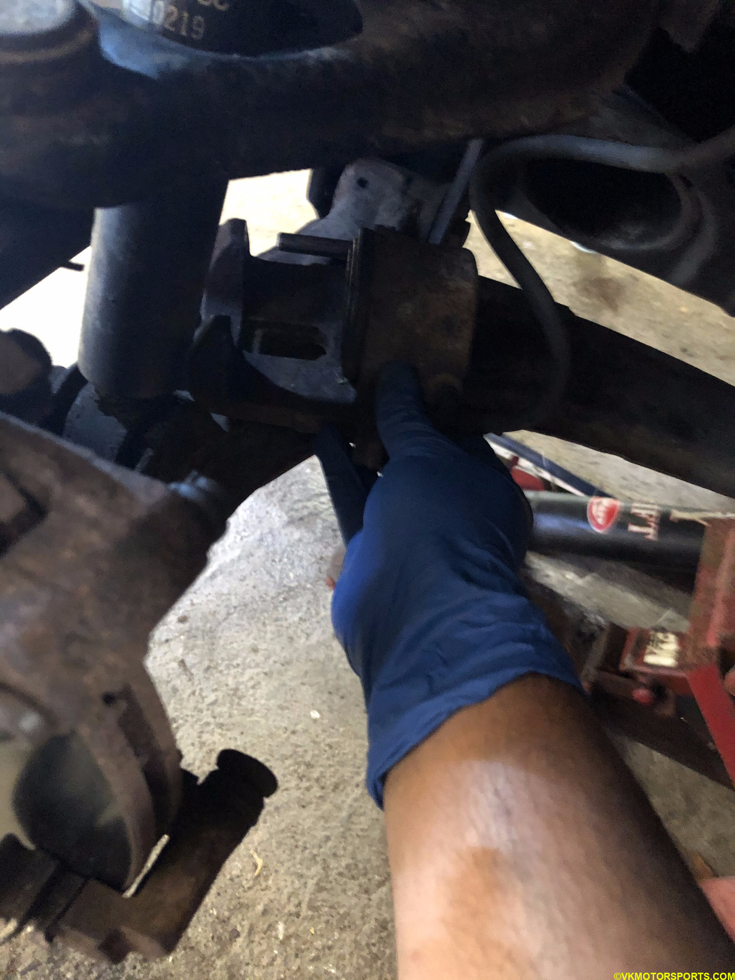 Place caliper safely on a control arm