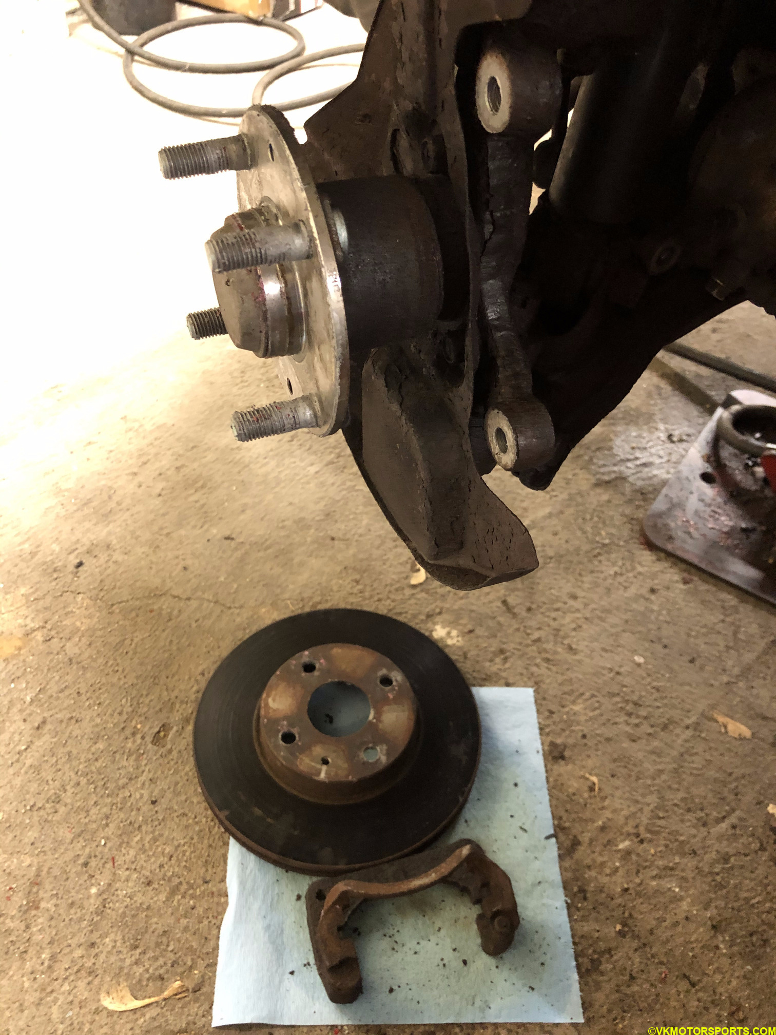Rotor removed and wheel hub exposed on the driver side