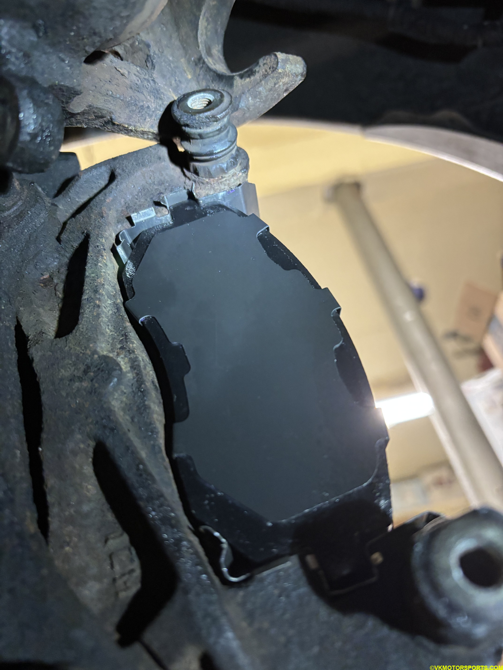 Figure 10. View from under the car of the new brake pad installed